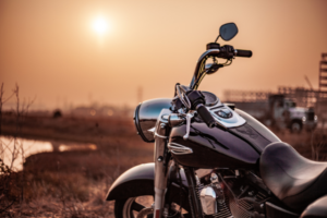 Photo of motorcycle against a sunset backdrop.