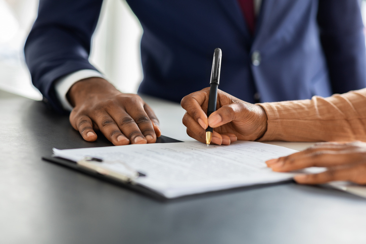Attorney and client reviewing documents