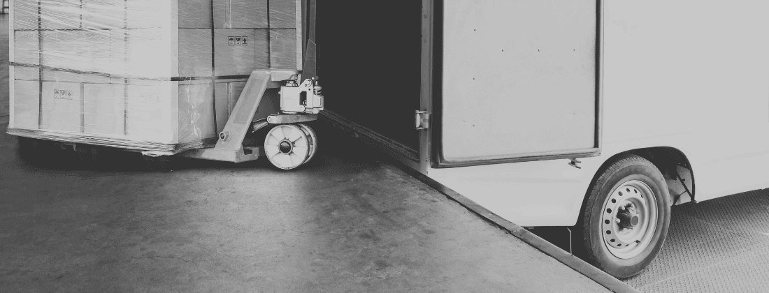 Overloaded commercial truck being inspected at weigh station on I-5