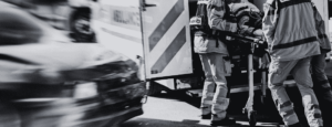 Blog banner image showing a vehicle accident victim being loaded into an ambulance.