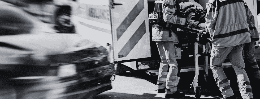 Blog banner image showing a vehicle accident victim being loaded into an ambulance.