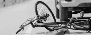 Image of a bicycle under a car for How to Assess Fault When Multiple Motorists Strike a Bicyclist