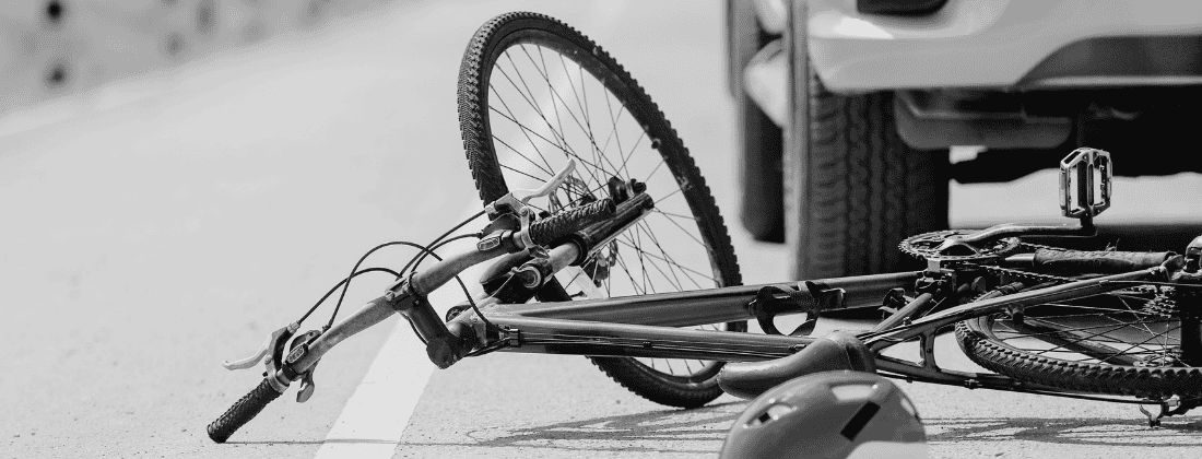 Image of a bicycle under a car for How to Assess Fault When Multiple Motorists Strike a Bicyclist