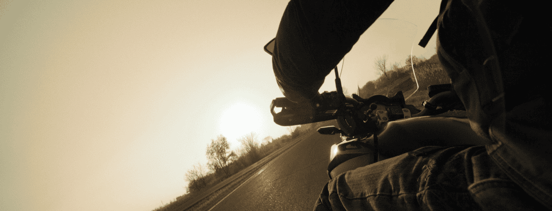 Photo of a motorcycle rider on a California freeway.
