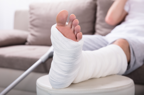 A person resting an injured leg