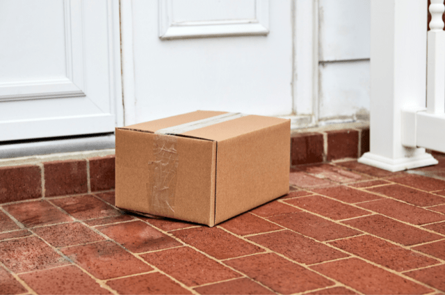 image of a delivery box at the front door of a home