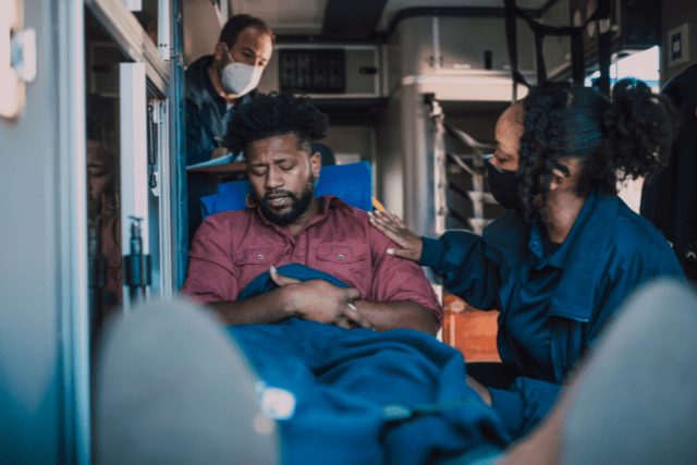 person in an ambulance being treated