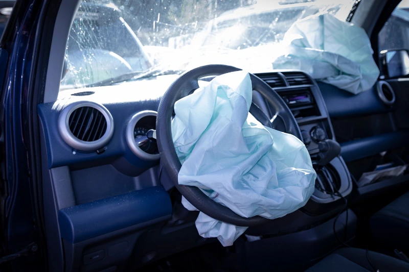 salvage car with airbags deployed with a broken windshield