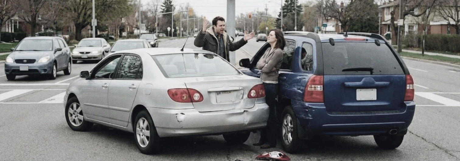 image of a car accident where the two drivers are disputing fault