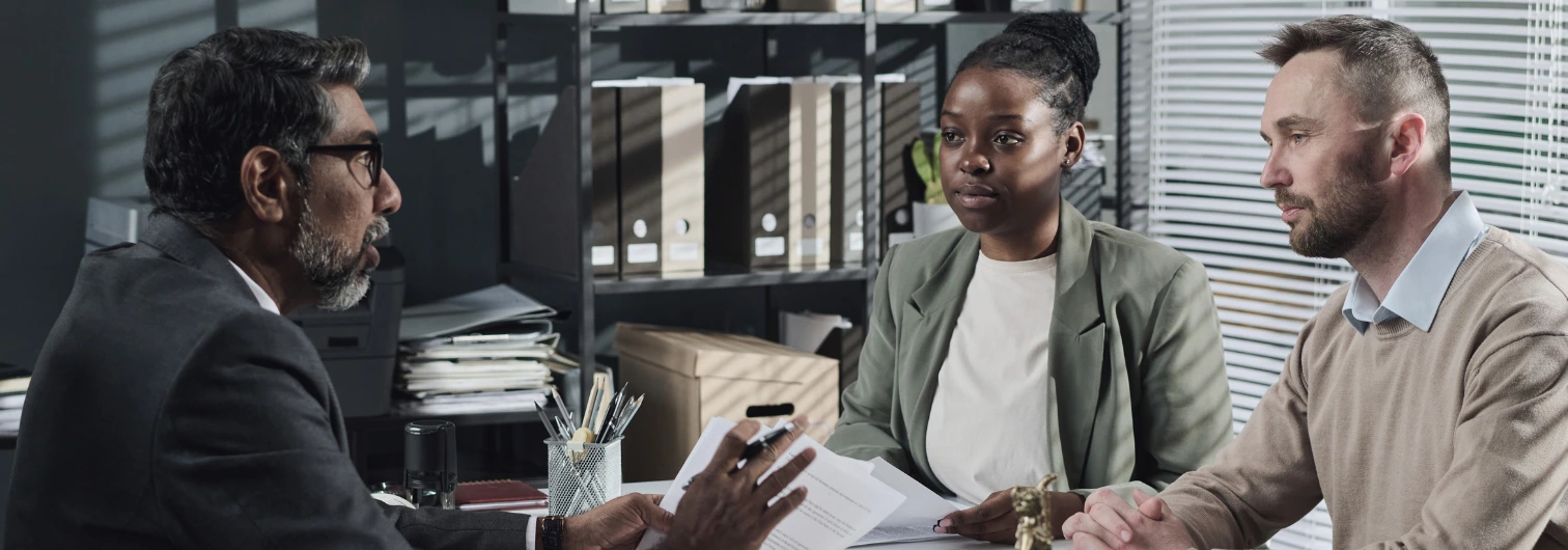 lawyer meeting with clients during a free consultation