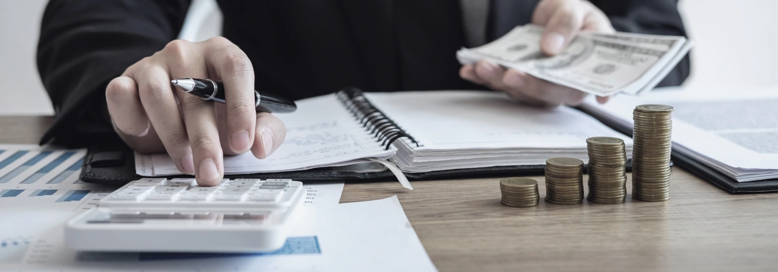 an individual calculating different parts of a settlement