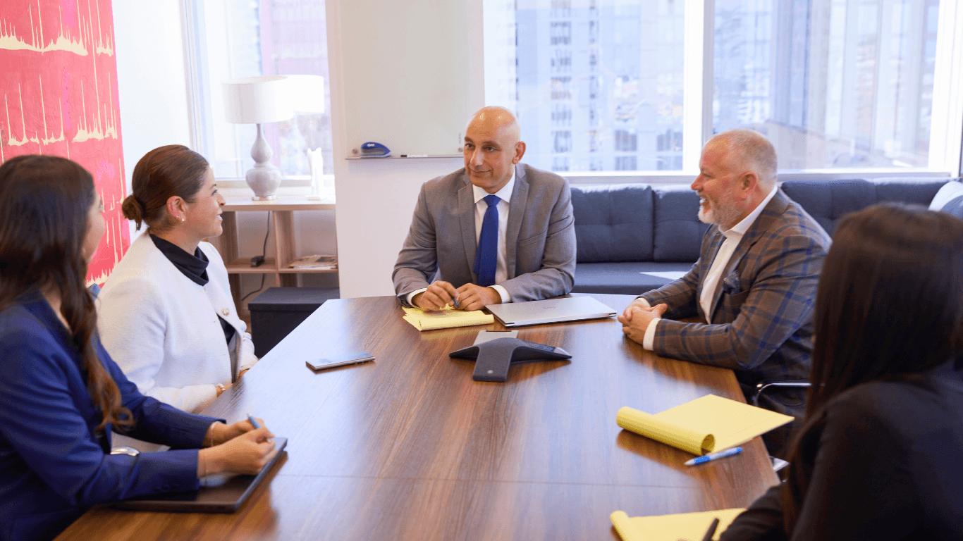 Photo of a strategy meeting at El Dabe Ritter Trial Lawyers