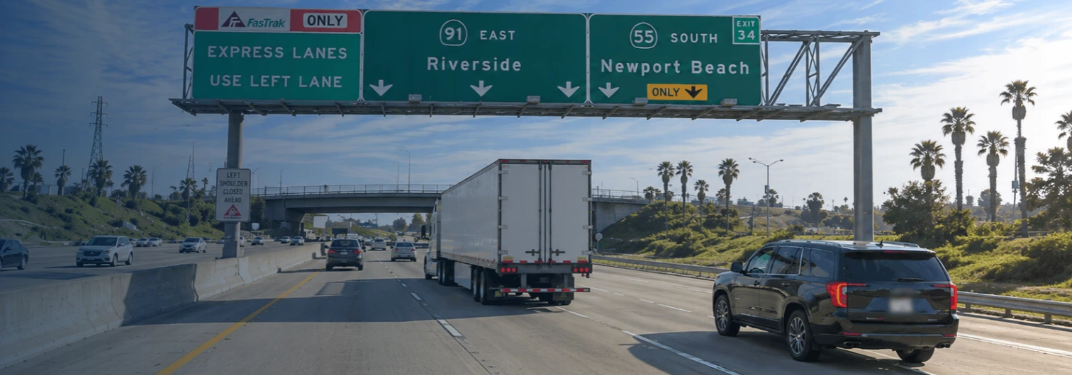 Semi-truck in the right lane of the 91 freeway near Anaheim Hills with heavy traffic visible