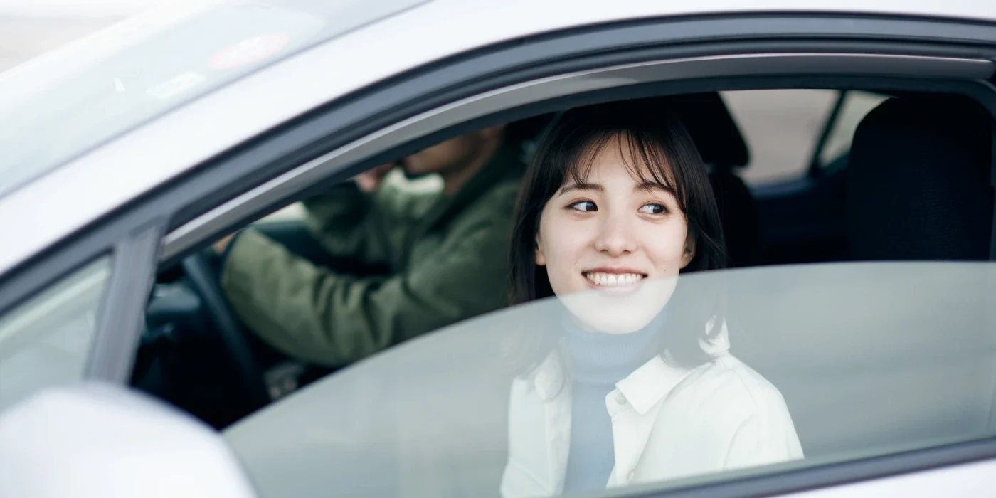 passenger looking out of a window of a vehicle